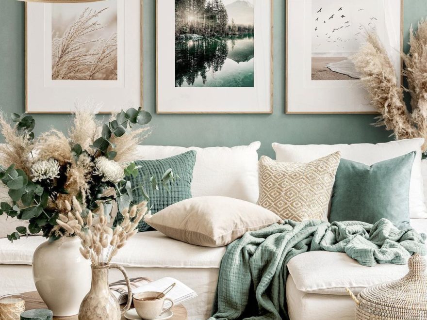 living room with cream contemporary sofa green wall and pillows and wall art gallery